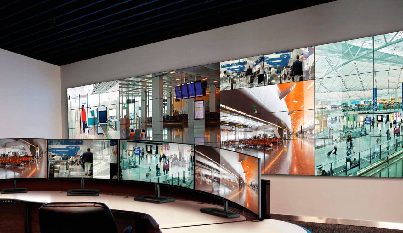 it shows many screens arranged radially and the display shows some pictures of mall