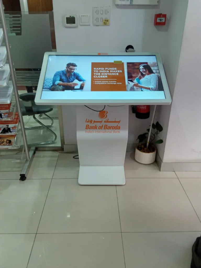 A white interactive lcd screen with a visual representation of a man and women on it.