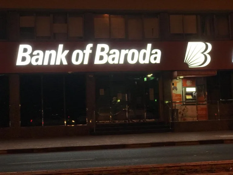 The illuminated Bank of Baroda 3D signage shines brightly at night