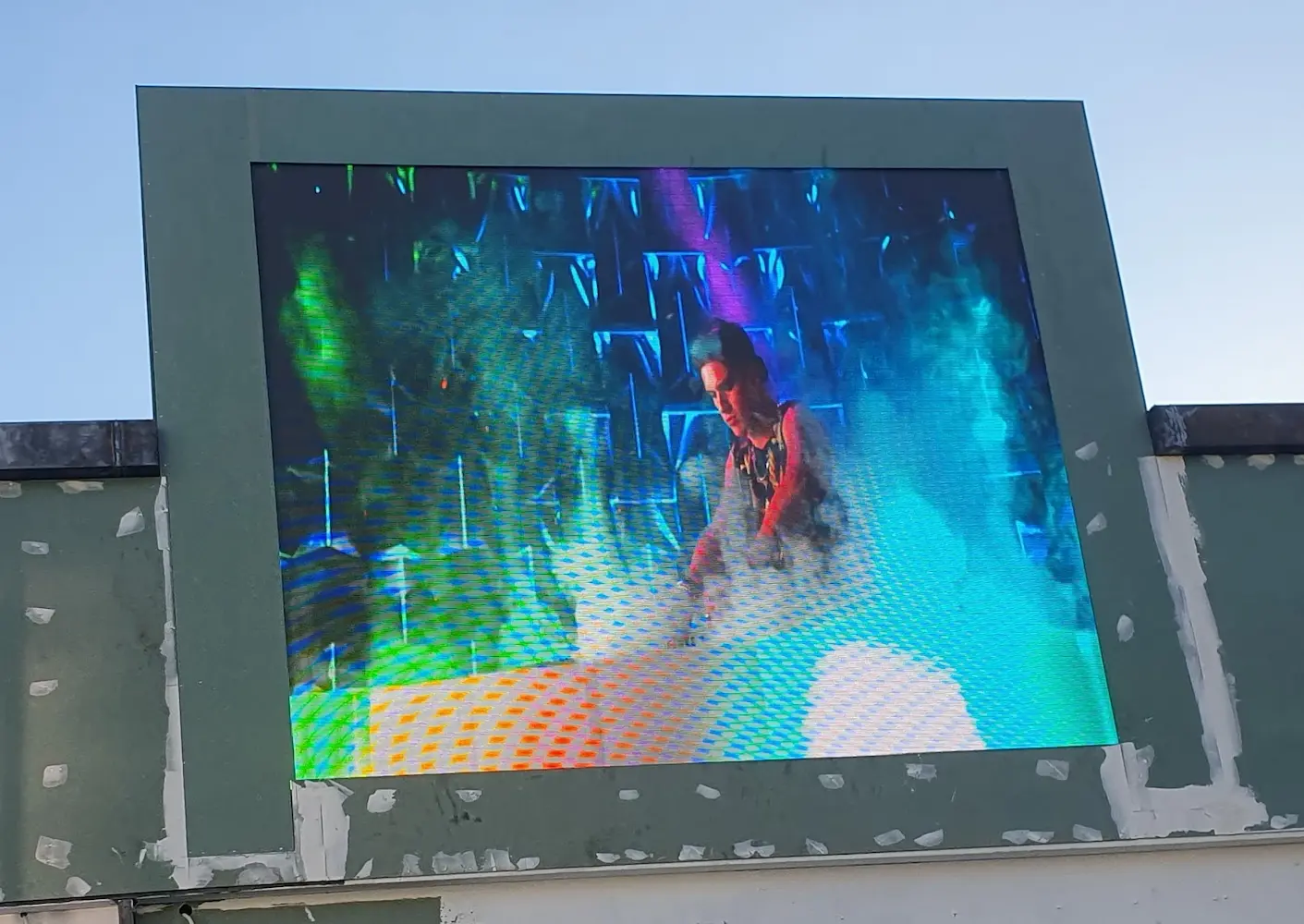 A large led display screen or led display screen outdoor displays a man in action