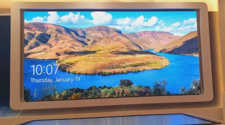 display LED screen featuring a beautiful lake with stunning mountains in the background.