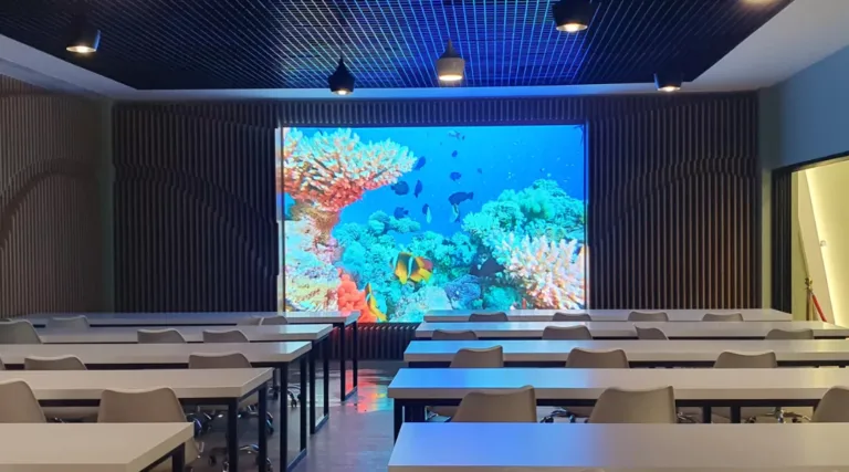 A conference room with an indoor LED screen, perfect for presentations.