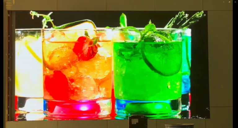 A large screen a variety of colorful beverages