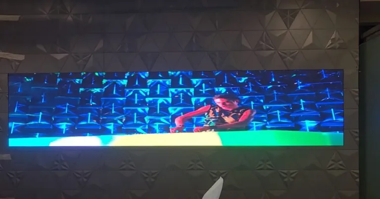 An LED display LED screen displaying a working man by Dubai LEDs