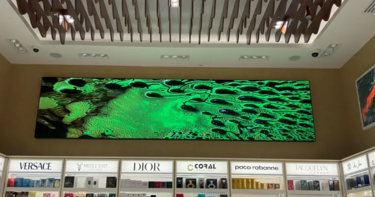 A store features a Custom LED displays, surrounded by shelves by LED display dubai.