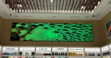 A store features a Custom LED displays, surrounded by shelves by LED display dubai.