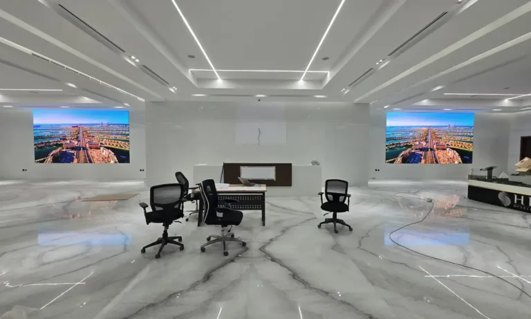 A stylish office with big indoor led wall screens.