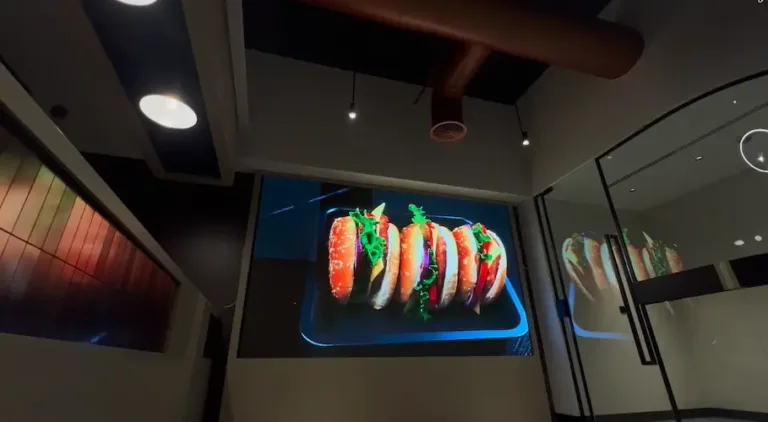 A Indoor LED Display Screen inside shows a taco on a plate, making it look delicious.