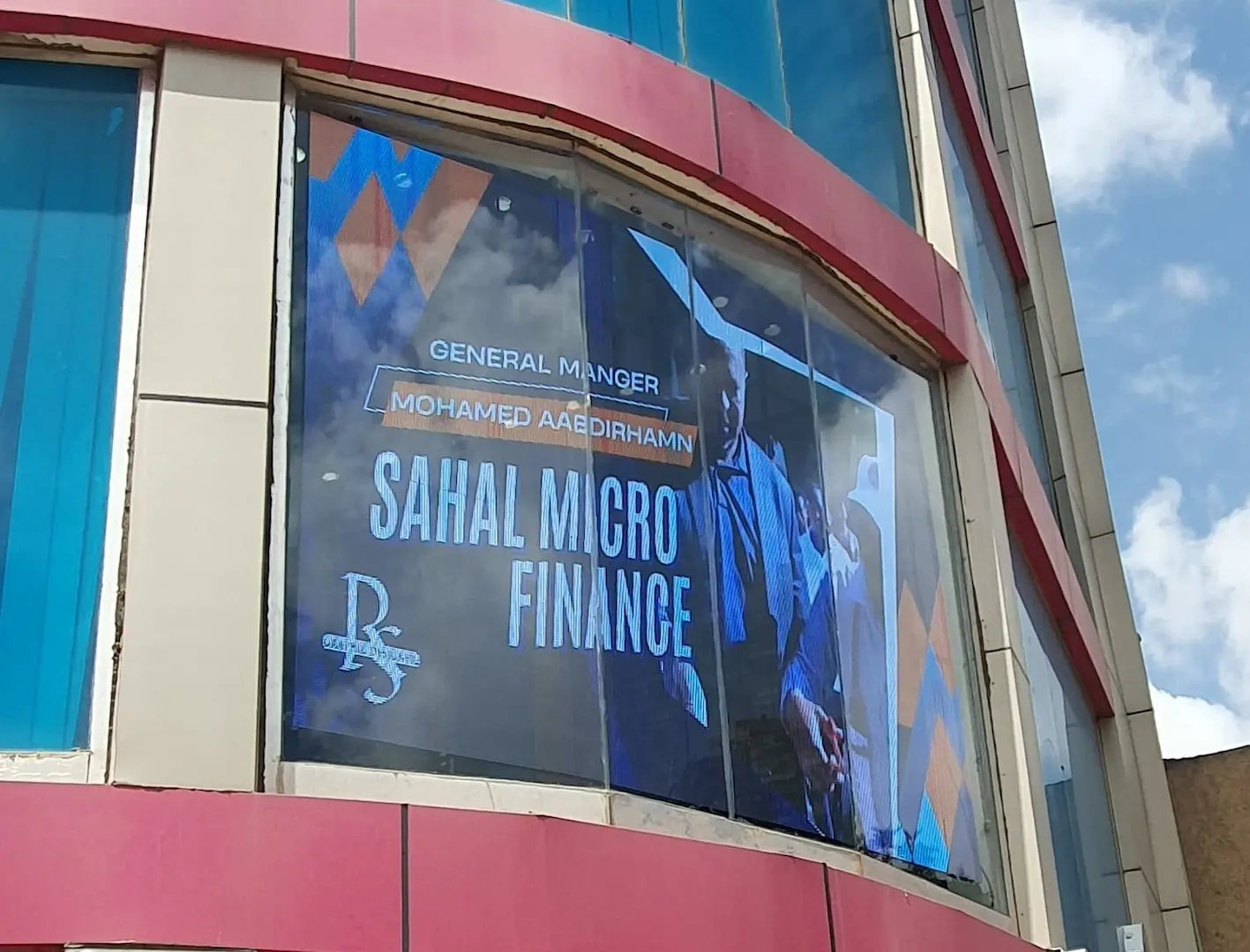 Transparent LED screen displaying Sahal Microfinance Bank logo