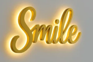 Illuminated 3d acrylic signage or 3D acrylic sign board on a wall, showcasing vibrant letters.