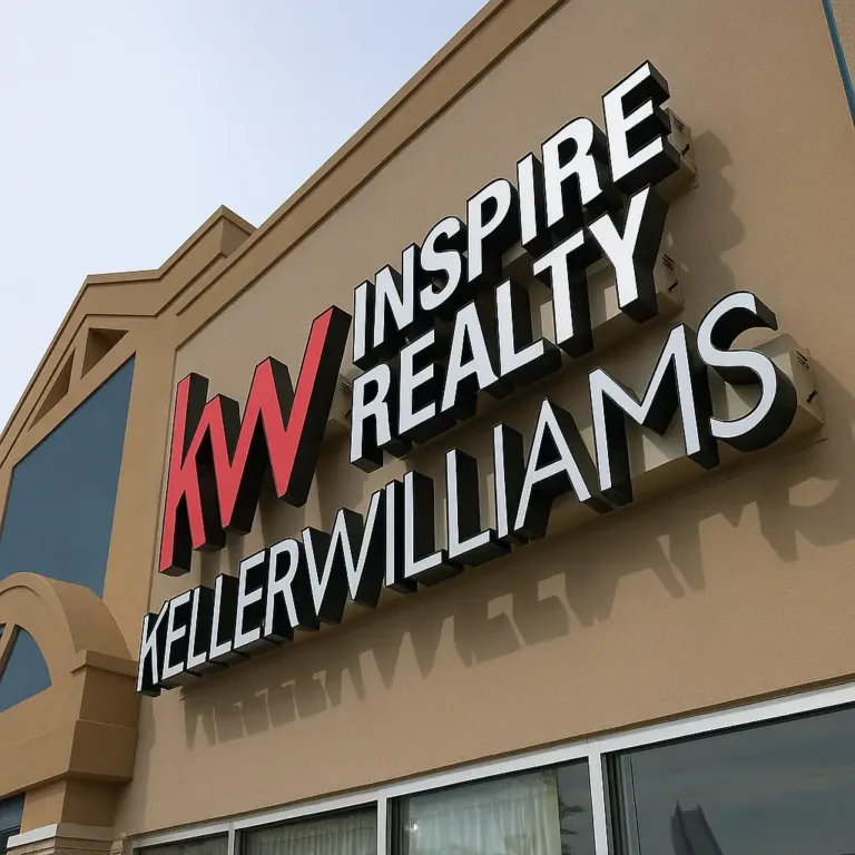 A vibrant Keller Williams 3D sign board or LED sign board 3D stands in front of a building.