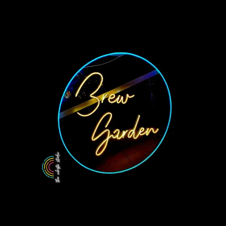 Bright neon sign reading "Brew Garden" against a dark background.