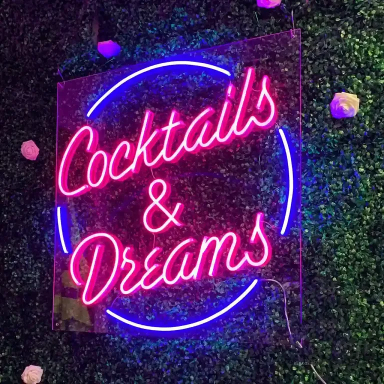 Neon signage written as cocktails and dreams.