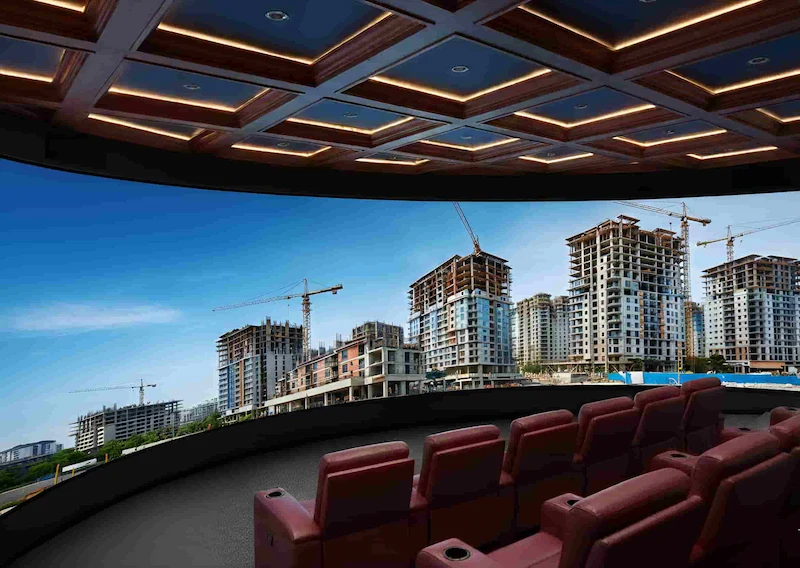 Curved LED display in a movie theater showcasing a vibrant view of a city skyline.