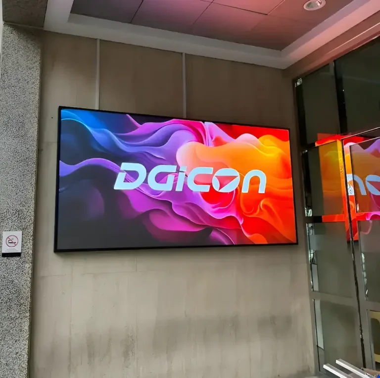 A outdoor LED screen mounted on the side of a building, displaying vibrant visuals.