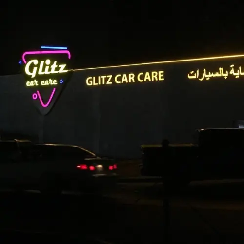 exterior neon sign for "GLITZ CAR CARE