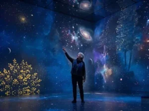 Man viewing immersive LED screen with stars and planets