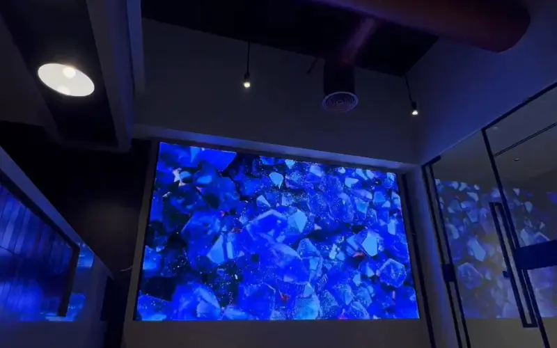 Indoor LED video wall displaying a blue crystal visual