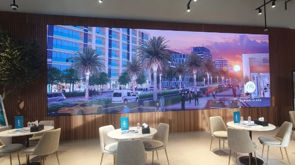 Indoor LED video wall in a showroom displaying a real estate project visual, installed by DGICON