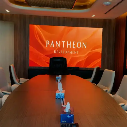 Wall-mounted indoor LED display in a corporate meeting room in the UAE