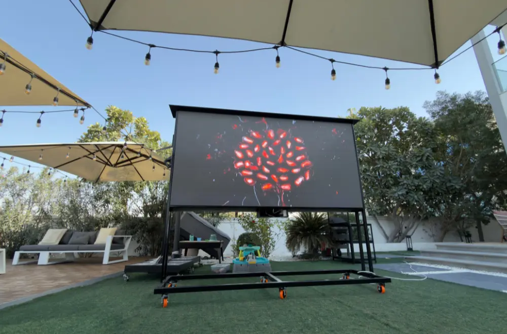 outdoor LED display screen showing red abstract visuals