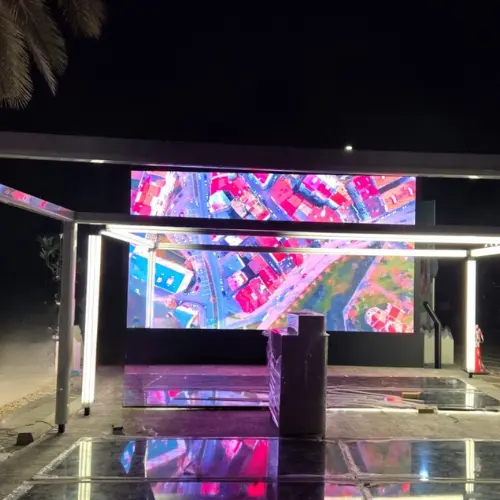 Outdoor LED display at night, showing an aerial city map