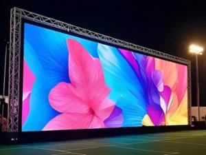 Outdoor rental LED screen showing a colorful floral display