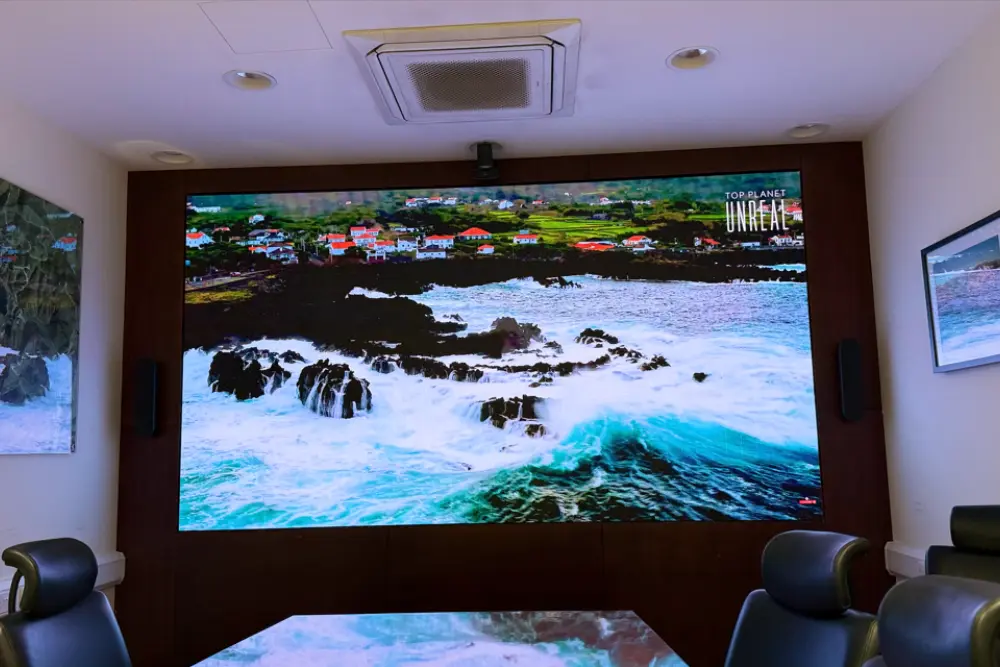 Conference room with wall-mounted LED display screen for meetings