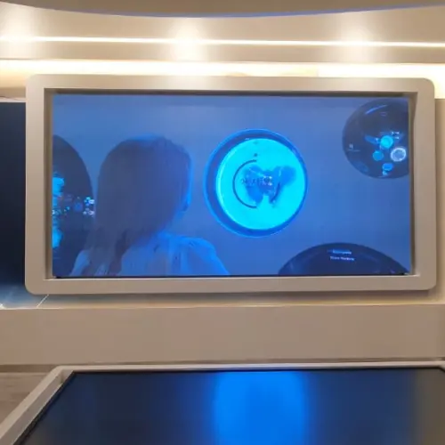 P1.86 indoor LED display screen in a framed wall at an indoor event space