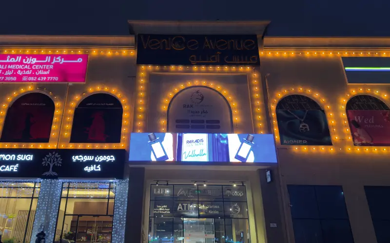 Outdoor LED screen above the entrance of Venice Avenue at night